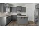 Kitchen features granite countertops, stainless steel appliances, and gray cabinetry at 197 Park View Dr, Stanfield, NC 28163