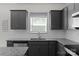 Close up of kitchen featuring gray cabinets, stainless steel appliances, granite countertops, and white subway tile backsplash at 197 Park View Dr, Stanfield, NC 28163