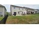 Spacious backyard with a concrete patio and a dining set, perfect for outdoor entertaining at 2014 Burton Point Ct, Waxhaw, NC 28173