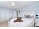 Cozy bedroom with soft, neutral tones and a comfortable-looking bed with ceiling fan at 2014 Burton Point Ct, Waxhaw, NC 28173
