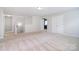 Spacious bonus room with neutral carpeting and ample natural light. Perfect for a play or media room at 2014 Burton Point Ct, Waxhaw, NC 28173
