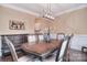 Elegant dining room featuring a large wooden table and stylish chandelier at 2014 Burton Point Ct, Waxhaw, NC 28173
