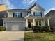 Charming two-story home with a well-maintained lawn and attached two-car garage at 2014 Burton Point Ct, Waxhaw, NC 28173