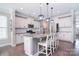 Modern kitchen with stainless steel appliances, granite countertops, and center island with seating at 2014 Burton Point Ct, Waxhaw, NC 28173