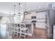 Open concept kitchen with an island, granite countertops, stainless steel appliances and bar stool seating at 2014 Burton Point Ct, Waxhaw, NC 28173