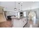 Features include a kitchen island, granite countertops, stainless steel sink and open floorplan concept at 2014 Burton Point Ct, Waxhaw, NC 28173