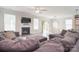 The living room showcases a fireplace, large sectional couch, and access to the dining area at 2014 Burton Point Ct, Waxhaw, NC 28173