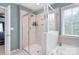 Beautiful main bathroom with a tile shower, soaking tub and bright natural light at 2014 Burton Point Ct, Waxhaw, NC 28173