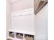 Organized mud room with built-in bench, hooks, and storage baskets, offering a practical entry solution at 2014 Burton Point Ct, Waxhaw, NC 28173