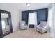 Comfortable sitting room with a mirror and bright natural light at 2014 Burton Point Ct, Waxhaw, NC 28173