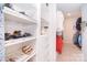 Custom walk-in closet with shelving, drawers, and ample storage space at 2014 Burton Point Ct, Waxhaw, NC 28173