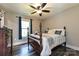 Bedroom featuring a traditional-style bed and decor, complemented by a window view at 202 Hickory St, Locust, NC 28097