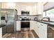 This spacious kitchen features stainless steel appliances and a subway tile backsplash at 202 Hickory St, Locust, NC 28097