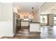 Modern kitchen with stainless steel appliances, white cabinetry, and a convenient breakfast bar at 202 Hickory St, Locust, NC 28097