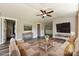 Cozy living room with neutral colors, updated flooring, contemporary furnishings, and recessed lighting at 202 Hickory St, Locust, NC 28097