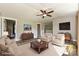 Staged living room with hardwood floors, neutral paint, a ceiling fan, and modern decor at 202 Hickory St, Locust, NC 28097