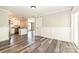 Open-concept living space features updated floors, fresh paint, and lots of natural light at 202 Hickory St, Locust, NC 28097