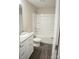 Full bathroom with tub/shower combo, granite vanity, modern fixtures, and luxury vinyl plank flooring at 206 N Kayla Dr, Salisbury, NC 28146