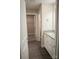 Bright bathroom featuring granite vanity, white cabinets and luxury vinyl floors at 206 N Kayla Dr, Salisbury, NC 28146