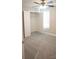 Carpeted bedroom with ceiling fan, closet, and window at 206 N Kayla Dr, Salisbury, NC 28146