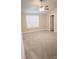 Bright bedroom featuring neutral carpet, ceiling fan, window, and white trim at 206 N Kayla Dr, Salisbury, NC 28146