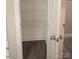 View into an organized walk-in closet with wooden floor and white wire shelving at 206 N Kayla Dr, Salisbury, NC 28146