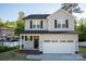 Charming two-story home featuring a two-car garage, covered front porch, and well-maintained landscaping at 206 N Kayla Dr, Salisbury, NC 28146