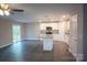 Open concept living space with kitchen island, stainless appliances and sliding glass doors at 206 N Kayla Dr, Salisbury, NC 28146