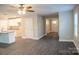 Open-concept living room features modern flooring and adjoins to a bright kitchen at 206 N Kayla Dr, Salisbury, NC 28146