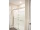 Modern bathroom featuring glass-enclosed shower with chrome hardware and tiled flooring at 206 N Kayla Dr, Salisbury, NC 28146