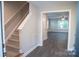 Entry with staircase leads to a living room featuring modern flooring at 206 N Kayla Dr, Salisbury, NC 28146