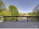 Wooden back deck overlooking a pond and golf course at 209 Tinkham Trl, Cramerton, NC 28032