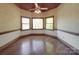 This bedroom has natural light and a ceiling fan with an ornate light fixture at 209 Tinkham Trl, Cramerton, NC 28032