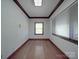 Bright bedroom features hardwood floors, a window, a skylight, and classic trim at 209 Tinkham Trl, Cramerton, NC 28032