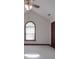 Bedroom with vaulted ceiling featuring a ceiling fan and an arched window at 209 Tinkham Trl, Cramerton, NC 28032