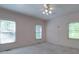 This bedroom offers great natural light from the two bright windows at 209 Tinkham Trl, Cramerton, NC 28032