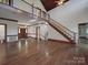 Spacious foyer with hardwood floors, staircase, and ample natural light at 209 Tinkham Trl, Cramerton, NC 28032