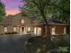 Beautiful brick home with a two-car garage and a spacious driveway at 209 Tinkham Trl, Cramerton, NC 28032