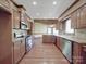 Spacious kitchen with stainless steel appliances and granite countertops at 209 Tinkham Trl, Cramerton, NC 28032