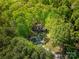 Scenic aerial view showcases a secluded home nestled among lush greenery and mature trees at 211 W Tennessee Ave, Bessemer City, NC 28016