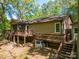 Back exterior view of a house with a deck that has stairs to the backyard at 211 W Tennessee Ave, Bessemer City, NC 28016