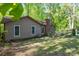 This backyard has privacy fencing and mature landscaping around the property at 211 W Tennessee Ave, Bessemer City, NC 28016