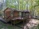 Brick exterior of the house with a screened-in porch and backyard deck at 211 W Tennessee Ave, Bessemer City, NC 28016