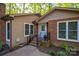 Side view of home showcasing brick and siding exterior with well-maintained landscaping at 211 W Tennessee Ave, Bessemer City, NC 28016