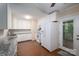 Updated kitchen features granite countertops, white cabinets, and stainless steel appliances at 211 W Tennessee Ave, Bessemer City, NC 28016
