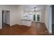 Bright living room featuring wood floors, white trim, and a modern ceiling fan at 211 W Tennessee Ave, Bessemer City, NC 28016