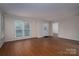 Spacious living room featuring a large window that fills the room with natural light at 211 W Tennessee Ave, Bessemer City, NC 28016