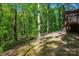 This home is situated on a heavily wooded lot with mature trees at 211 W Tennessee Ave, Bessemer City, NC 28016