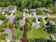 Beautiful property with a well-manicured lawn, mature trees, and lovely landscaping at 21907 Torrence Chapel Rd, Cornelius, NC 28031
