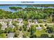 Breathtaking aerial shot showcasing a charming home nestled near Lake Norman surrounded by lush greenery at 21907 Torrence Chapel Rd, Cornelius, NC 28031
